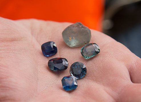 Beautiful faceted and rough sapphire from the new Rock Creek sapphire mine. Photo by Andrew Lucas/GIA.